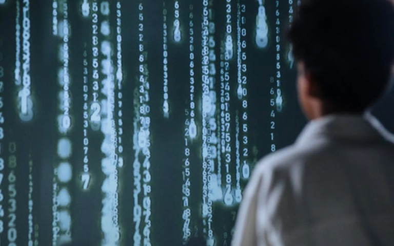 The image depicts a person silhouetted against a backdrop of cascading lines of digital code, suggesting a focus on technology, data, or computer-related tasks.