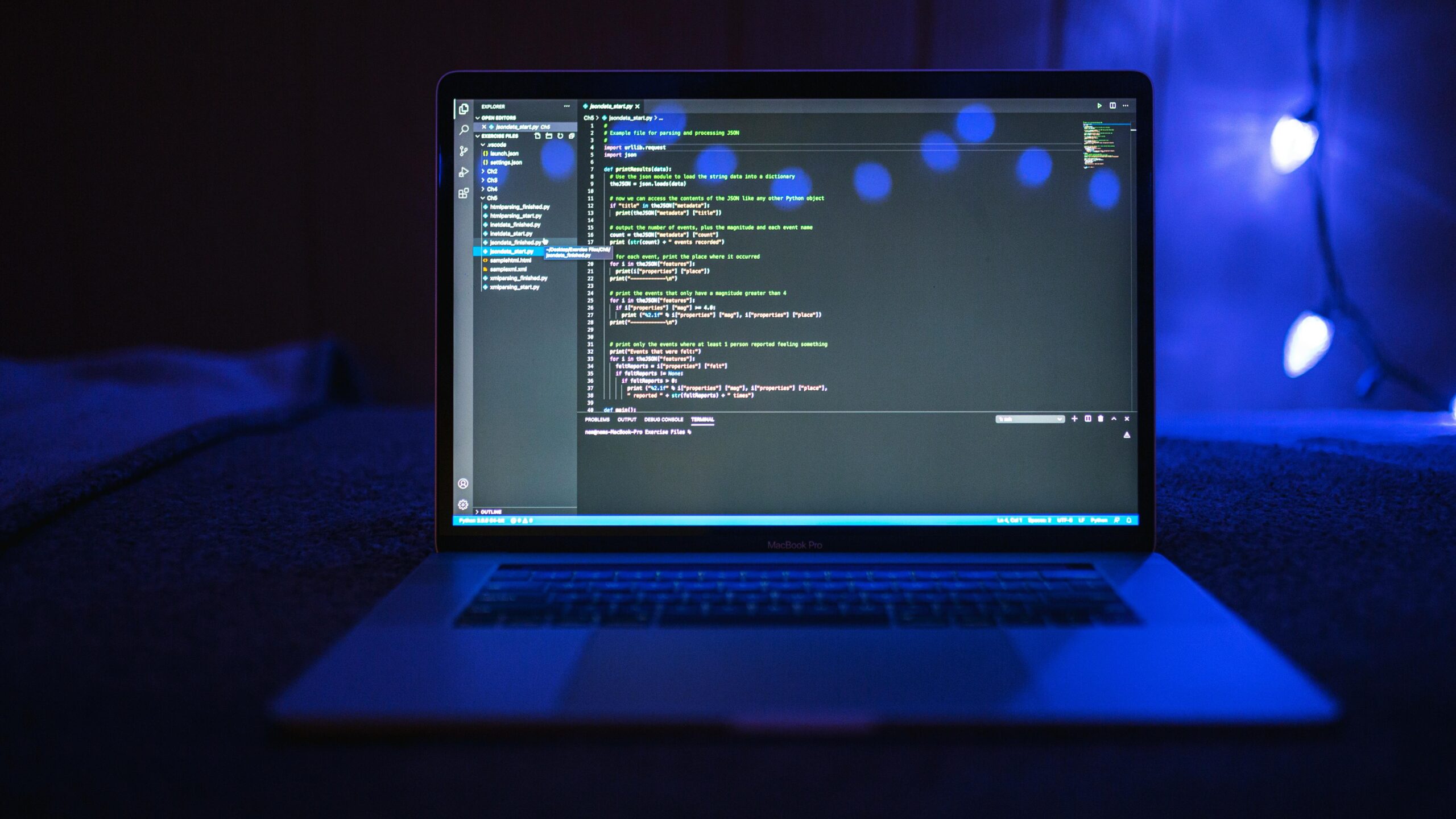 Laptop screen displaying programming code, symbolizing the importance of accessing security expertise MSSP for modern cybersecurity solutions.