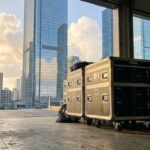 Portable server cases staged in urban facility representing physical infrastructure for secure cloud migration